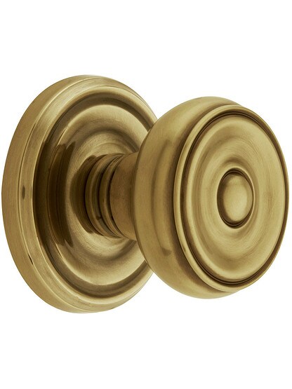 Classic Rosette Set With Waverly Knobs in Antique Brass.